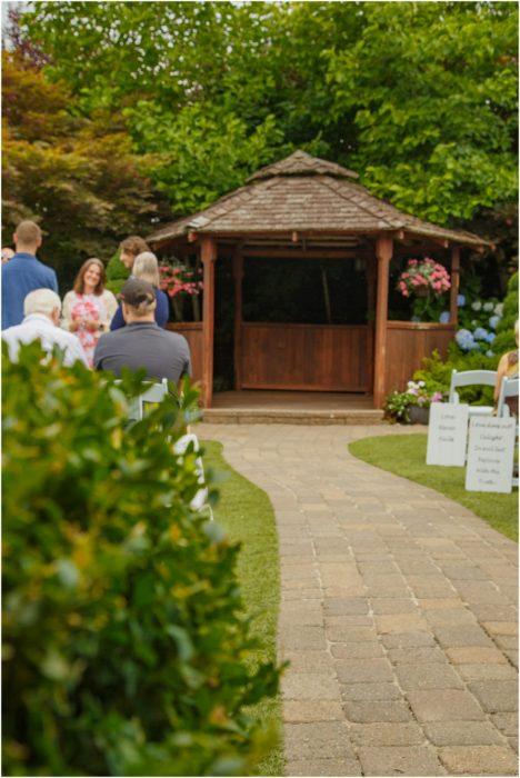 Ceremony 004 468x700 Winding Path Gardens Summer Wedding