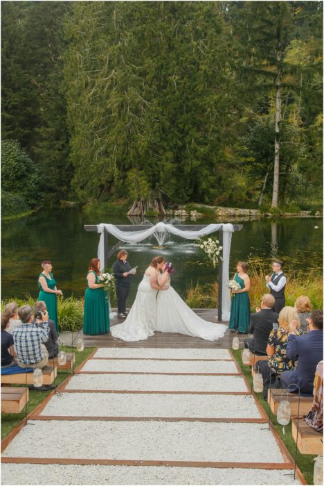 Ceremony 218 468x700 Gray Bridge wedding with a rainbow flag sendoff