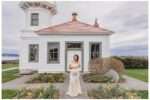 Pregnant woman at Mukilteo Lighthouse Beach during golden hour, wearing a cream lace maternity gown in soft shoreline poses and a teal fitted maternity dress with a long flowing train blowing in the ocean breeze, with the lighthouse and sunset in the background.