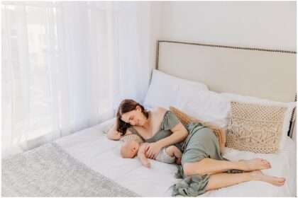 A mother gently breastfeeding her 6-month-old baby boy in a softly lit studio, capturing a tender and intimate moment of connection.