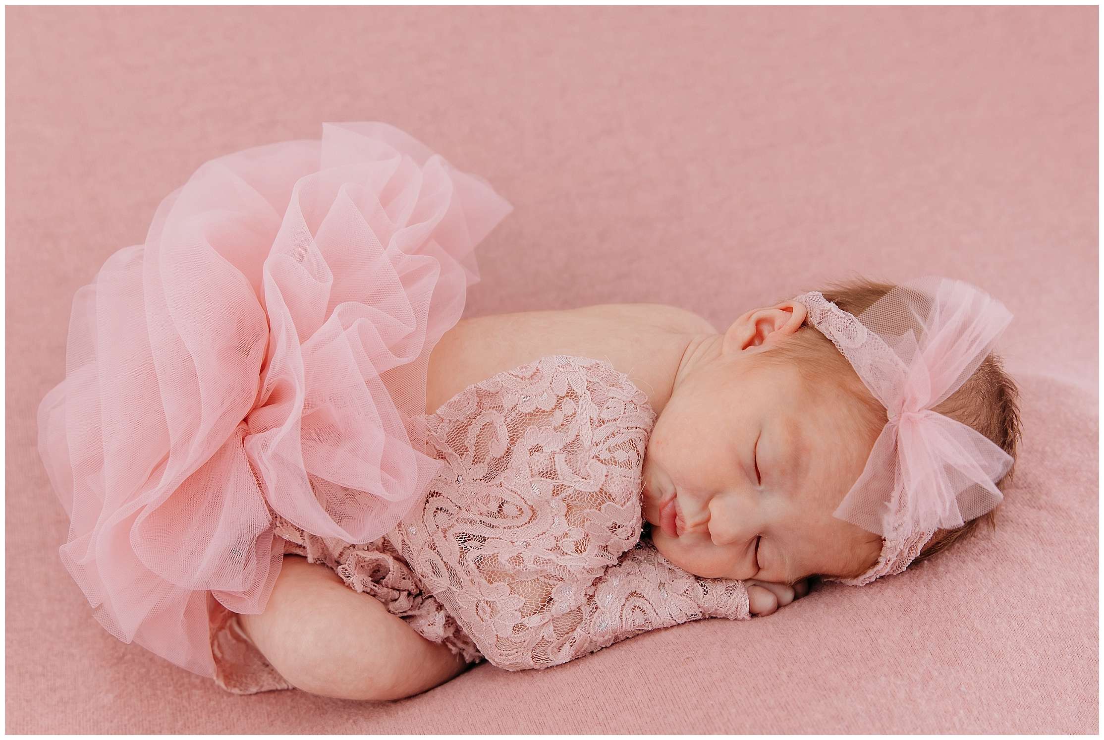 A little girl named Brooklyn in a downtown Everett studio wearing pink princess dresses with tulle and lace, posing in a soft, dreamy studio setting filled with feminine, girly decor.
